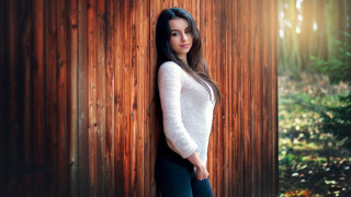 Woman leaning wooden wall forest - the wood free wallpaper