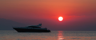 Boat sunset mountain ocean sky - a boat free wallpaper