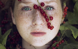 Berry freckled girl leaves closeup - a young girl free wallpaper
