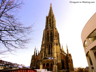 Cathedral clock tower city street - a large cathedral free wallpaper