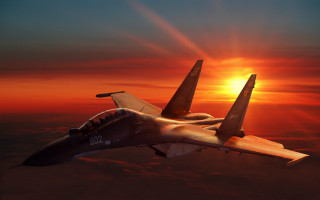Fighter jet sunset clouds backlit 3 - a sunset sky free wallpaper for desktop