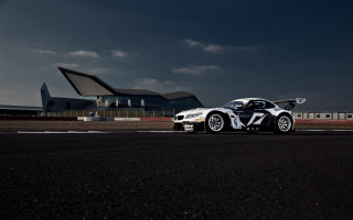 White car race track building - a white car free wallpaper