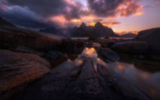 Sunset mountain river rocks cityscape - a sunset over a mountain range free wallpaper