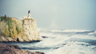 Lighthouse cliff waves beach ocean - a cliff free wallpaper