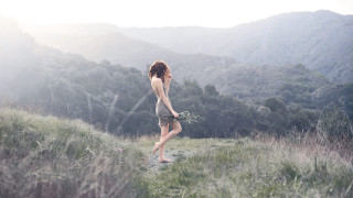 Woman field bouquet mountains nature - her hand and a mountain in the background free wallpaper