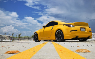 Yellow sports car road clouds - a yellow line free wallpaper