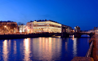 Night cityscape bridge reflections mountains - a bridge and buildings free wallpaper