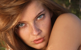 Freckled haired blue eyed woman - shaded free wallpaper