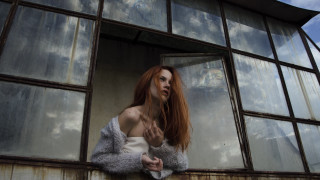 Woman redhair window sky clouds - natural light free wallpaper