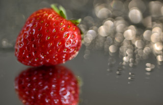 Strawberry reflection blurry background tiltshift - a reflective surface free wallpaper