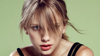 Woman black top green background - eric taylor free wallpaper