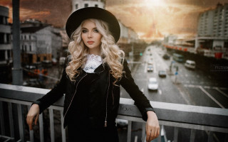Blonde woman gothic cityscape balcony - black jacket free wallpaper