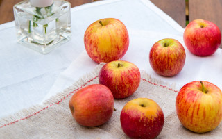 Apples vase flowers candle stilllife - top of a table next free wallpaper