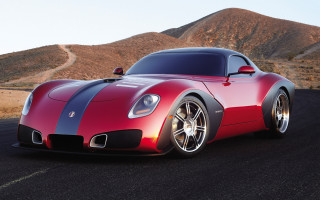 Red sports car mountain night - a blue stripe free wallpaper