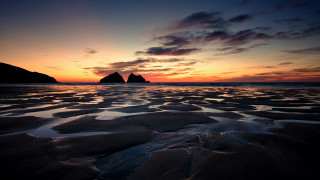 Sunset beach rock formation mountains - a few wave free wallpaper