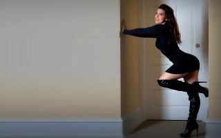 Woman black dress heels leaning - leaning against a wall free wallpaper for desktop