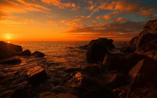 Sunset ocean rocks water orange 7 - orange sky above free wallpaper