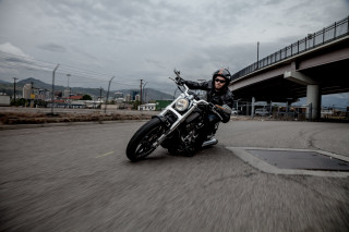 Man motorcycle bridge tilt shift - dan scott free wallpaper