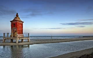 Red tower beach sunset ocean - a sandy beach next free wallpaper for desktop