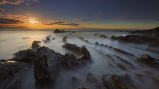 Sunset rocky beach waves horizon - the shore free wallpaper
