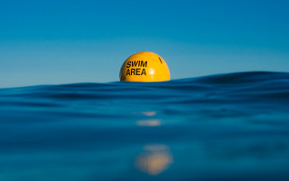Yellow buoy ocean swim sign - anna findlay free wallpaper
