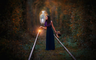 Woman holding light traintrack woods - a train track free wallpaper