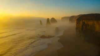 Beach cliffs foggy sky water - a foggy sky above free wallpaper