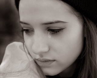Sad woman crying cellphone tears - emotional free wallpaper