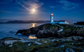 Lighthouse rocky shore moonlit water - moonlight free wallpaper