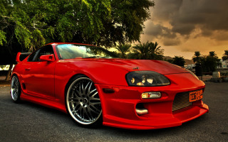 Red sports car cloudy sky 8 - red eye free wallpaper for desktop