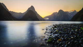 Sunset mountains lake rocks clouds - carl critchlow free wallpaper
