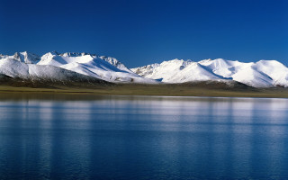 Mountain snow lake sky beautiful - a lake below free wallpaper