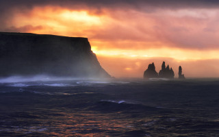 Ocean rocks sunset cloudy sky - a cloudy sky above them free wallpaper