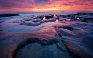 Sunset rocky beach ice water - ice free wallpaper