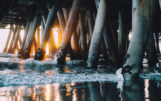 Pier water poles rocks cinematic - a pier free wallpaper