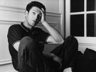 Man sitting floor hands on - a window in the background free wallpaper