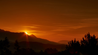 Sunset mountains trees clouds orange - a sunset free wallpaper