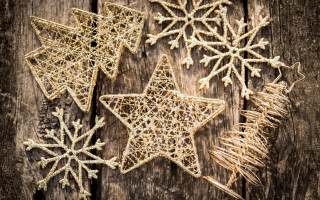 Christmas ornaments wooden surface snowflakes - a pine cone free wallpaper
