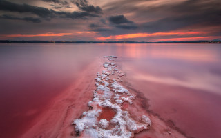 Snowy shoreline pink sunset mountain - the shore of a lake free wallpaper