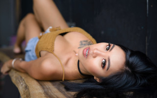 Tattooed woman lying on wooden - tattoo free wallpaper