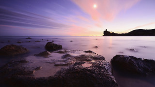 Sunset lighthouse rocky beach purple - a long exposure of a sunset over a rocky beach free wallpaper