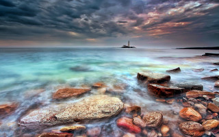 Rocky beach lighthouse mystical colors - a rocky beach free wallpaper