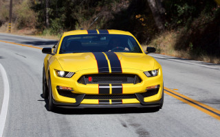 Yellow mustang driving road black - hood free wallpaper