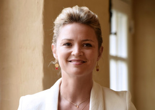 Woman white jacket smiling window - a white jacket free wallpaper