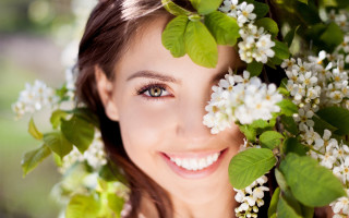 Woman blue eyes flower smile - facial feature free wallpaper