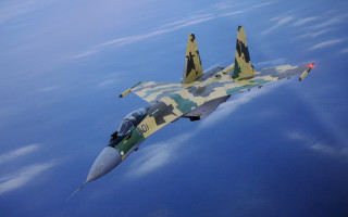 Camouflaged fighterjet redlight jigsaw aircraft - its tail free wallpaper