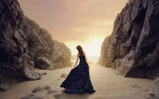 Woman black dress cave beach - a cave free wallpaper