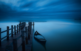 Docked boat lake night cloudy - a pier free wallpaper