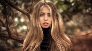 Woman longhair tree serious portrait - her face and shoulders free wallpaper for desktop