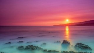 Sunset water rocks mountain mystical - the foreground and a mountain in the background free wallpaper